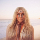 Kesha Postpones Tour Dates Following ACL Tear Photo