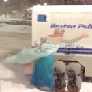 VIDEO: Man Dressed as Elsa Pushes Police Wagon Stuck in Snow