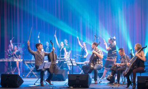 Arena-Style Rock Concert And String Quartet Recital Combine For Break Of Reality At April Elm Street Concert Image