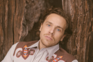 Kris Kelly Explores LGBTQ+ Identity On New Chamber Pop Song 'Cracked Porcelain' Image