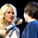 VIDEO: Viral Video - Carrie Underwood Gives 12 Year Old Fan 'First Kiss' in Concert Video