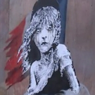VIDEOS: Elusive Street Artist Banksy Uses LES MISERABLES Logo To Protest French Tear-Gassing of Refugees