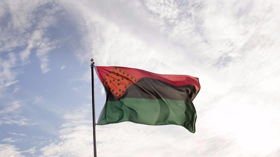Creative Time Raises Artist Nari Ward's PLEDGES OF ALLEGIANCE Flag Image