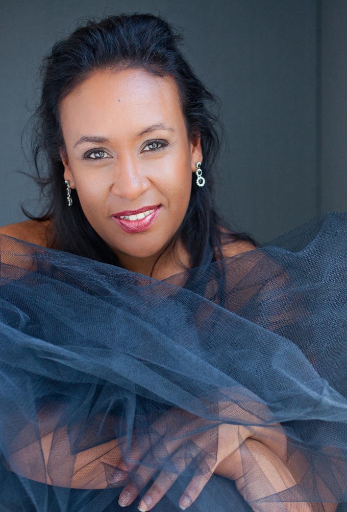 Local Comedian and MC Mel Jones Casts a Spell in International Dinner Cirque Show ENCHANTED Image