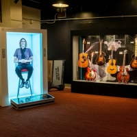 The Folk Americana Roots Hall of Fame Debuts AI Experience in its Life in Six Stings Photo