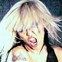 Miley Cyrus Announces Deluxe 'ATTENTION: MILEY LIVE' Album Photo
