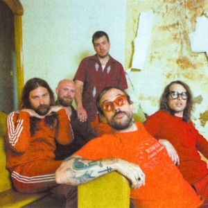 Video: IDLES Share 'Grace' Video Inspired By Coldplay's 'Yellow' Photo