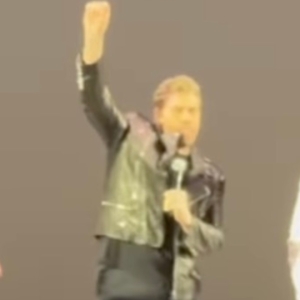 Video: John Travolta Surprises Fans as 'Danny Zuko' at GREASE Sing-Along Photo