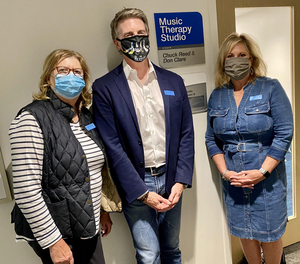 St. Elizabeth Cancer Center Dedicates Music Therapy Room In Honor Of Two Suits That Rock Volunteers Image