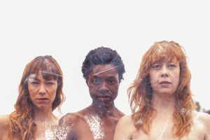 Downstage to Present SHE SPREADS Image