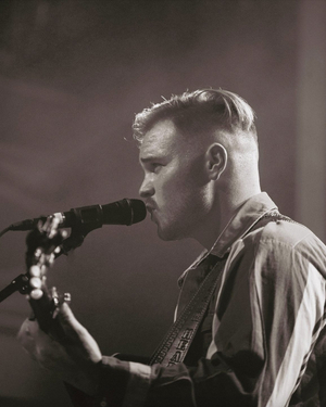 Country Star Zach Bryan Releases New Single 'Something In The Orange'; Tour Schedule Image