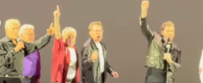 Video: John Travolta Surprises Fans as 'Danny Zuko' at GREASE Sing-Along