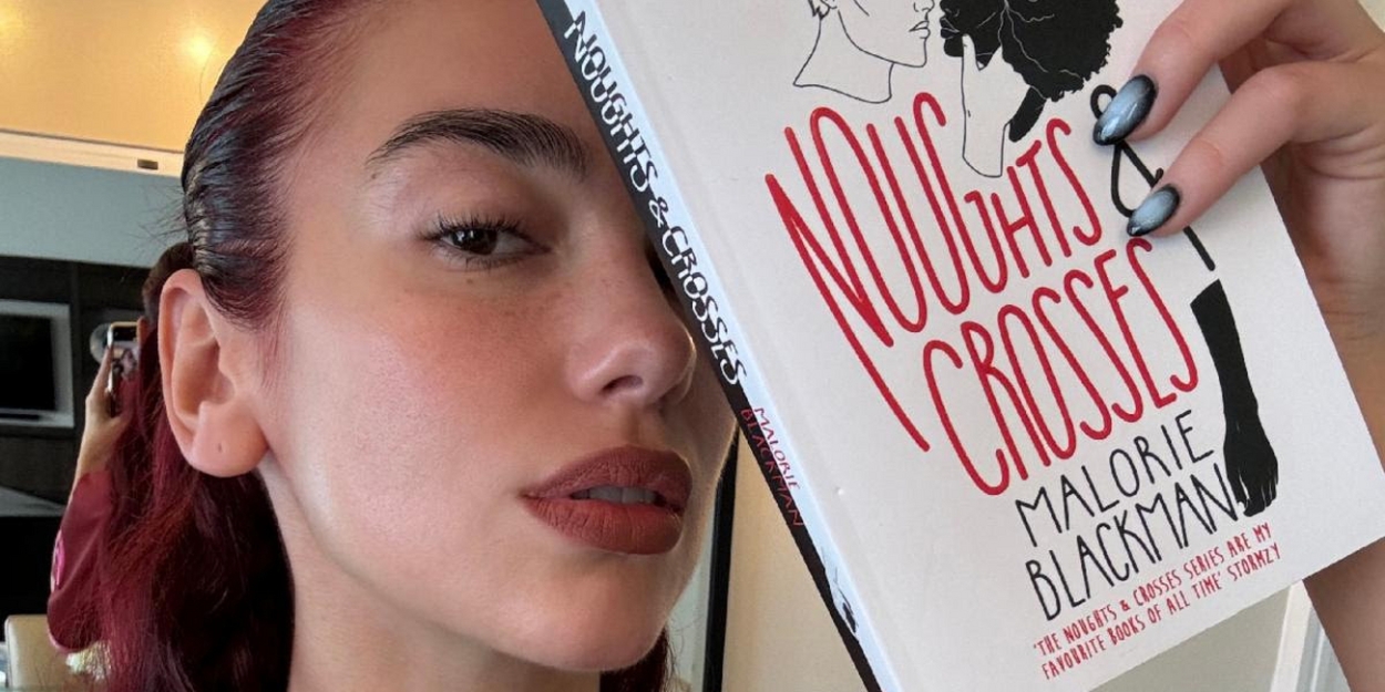 Dua Lipa's Service95 Book Club Reveals July Monthly Read: 'Noughts & Crosses' by Malorie Blackman  Image