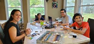 Local Boy Making Mask Aids To Support Jewish Family Services Food Pantry  Image