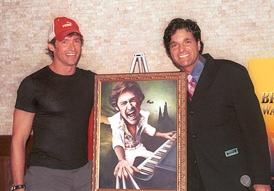 Hugh and Dale posing with the painting at 