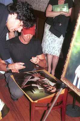 Hugh autographing lithographs to be auctioned to raise money for Broadway Cares/Equity Fights Aids. at 