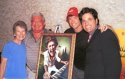 Hugh celebrates the painting with his Step Mom, Dad & Dale at 