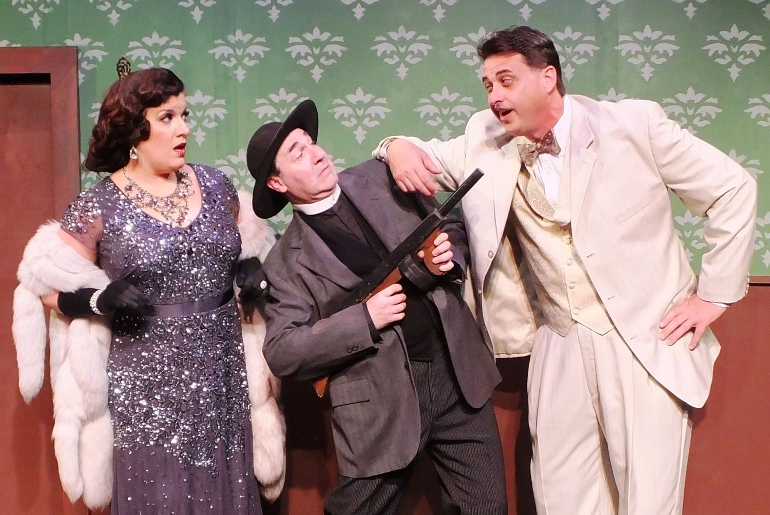 Comic antics ensue in Cole Porter’s musical comedy Anything Goes as Lord Evelyn Oakley (Tom Pagano of Clinton Twnp.) mixes up his American phrases to Moonface Martin (Michael A. Gravame of Detroit) as Reno Sweeney (Danielle Caralis of Birmingham) looks on in delight.