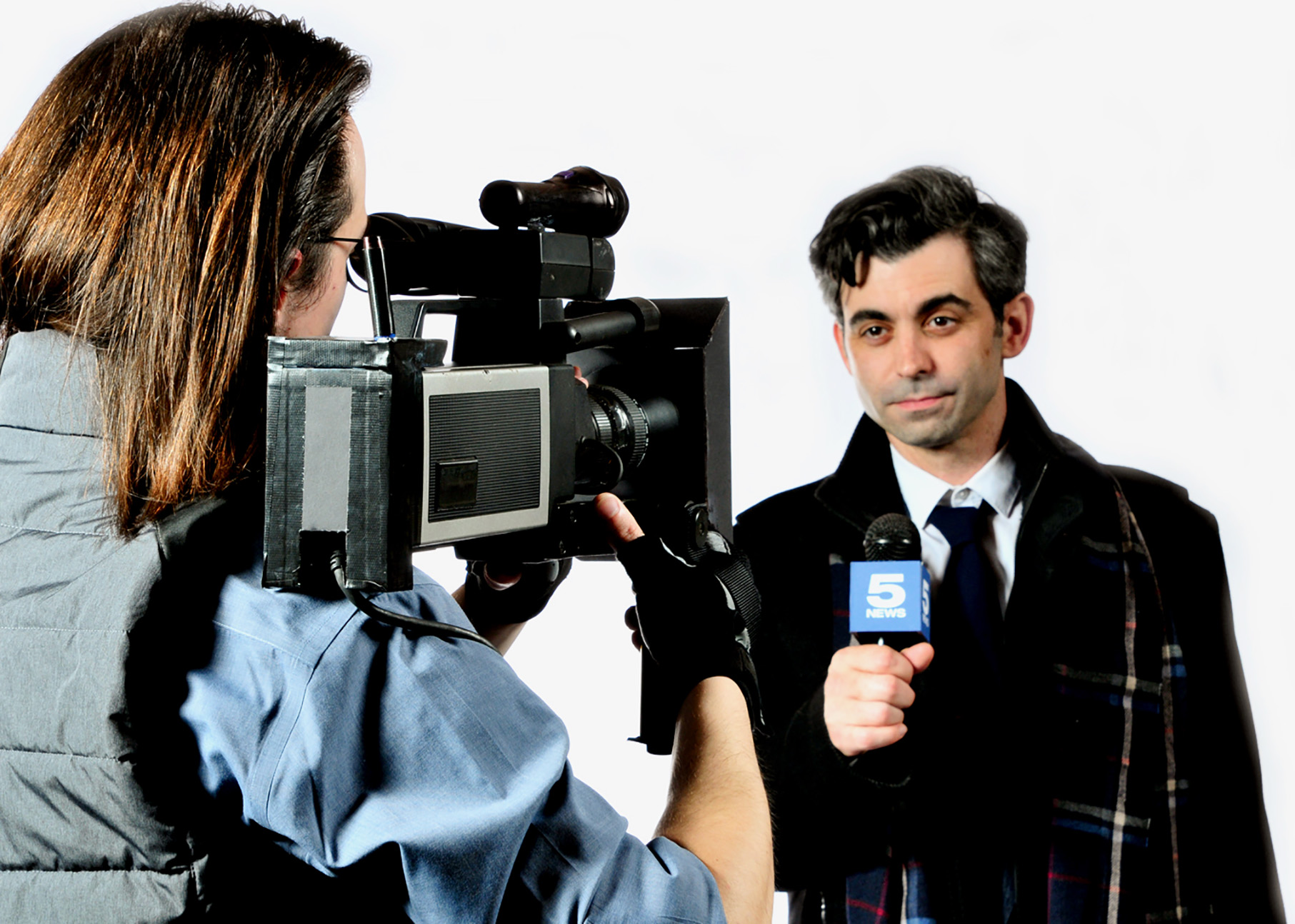 Keaton Fields as Larry the cameraman films Travis Bilenski as Phil Connors, the TV weatherman, in the musical comedy Groundhog Day: The Musical, playing at Lakewood Theatre Company, located at 368 S. Keaton Fields as Larry the cameraman films Travis Bilenski as Phil Connors, the TV weatherman, in the musical comedy Groundhog Day: The Musical, playing at Lakewood Theatre Company, located at 368 S.