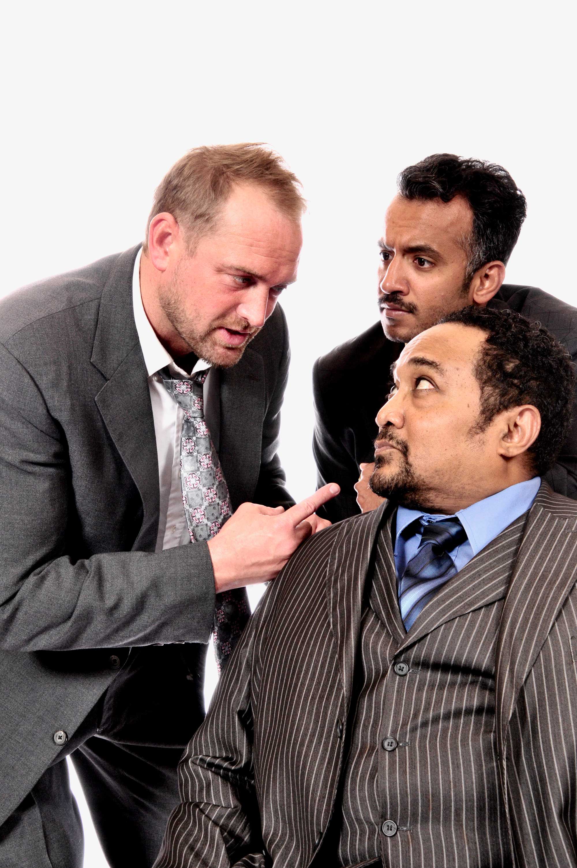 The Maltese Falcon (left to right) Ty Boice (Sam Spade), Bobby Bermea, seated (Casper Gutman), and Parth Ruparel as Joel Cairo in The Maltese Falcon playing at Lakewood Theatre Company, 368 S. State S