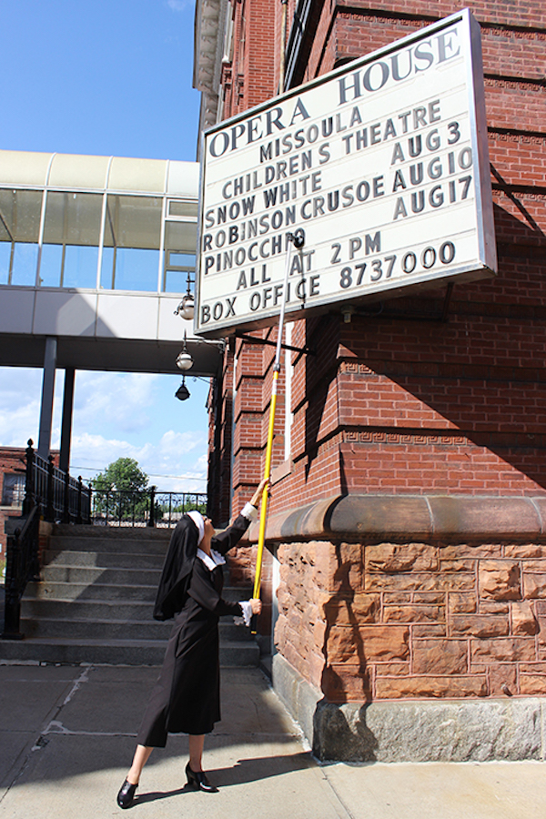 Sister Mary Michelle (aka Waterville Opera House assistant executive director Michelle Sweet) changes the marquis outside the historic Waterville Opera House in preparation for opening night on Thursday, September 5, 2019!
