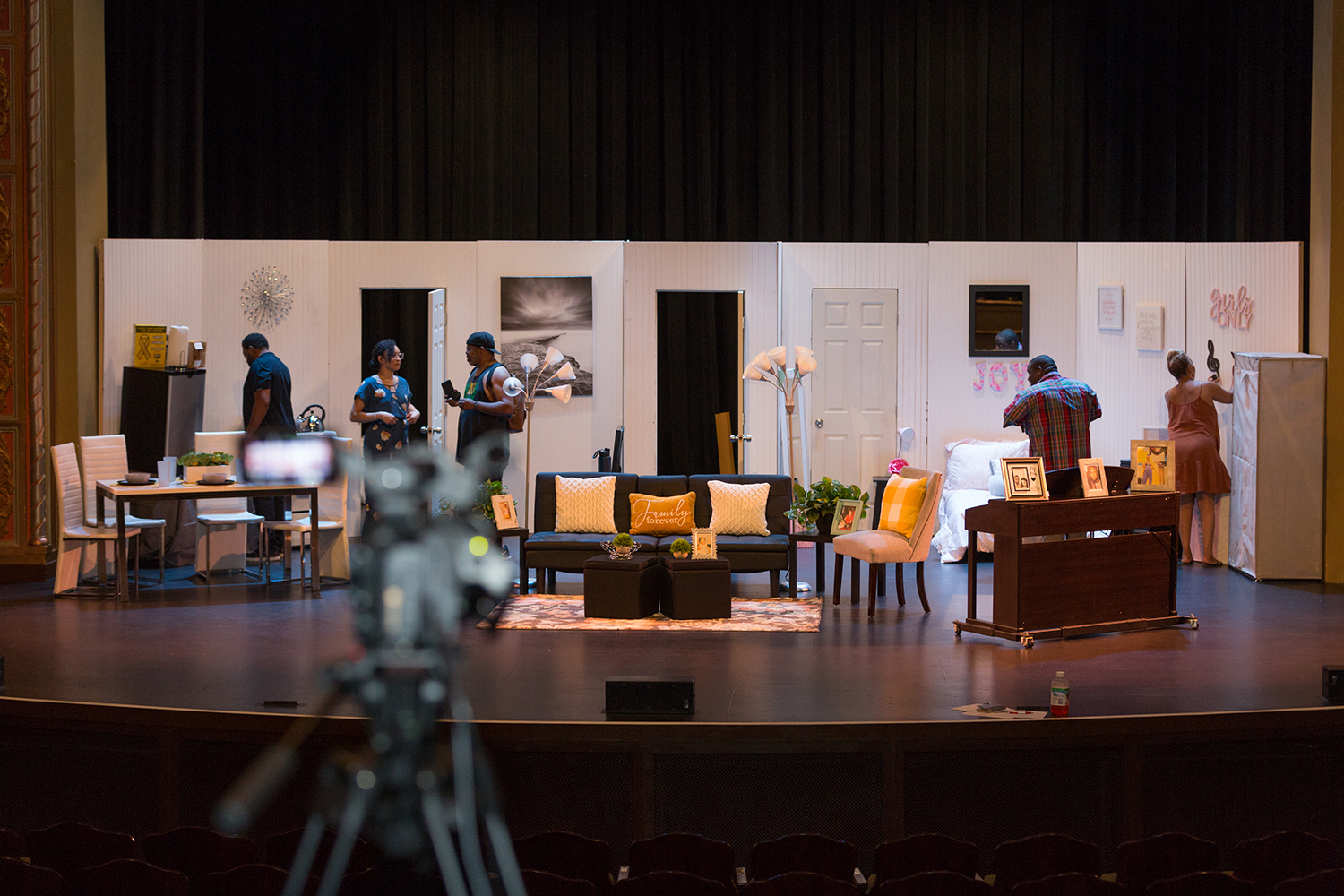 Writer, producer, director and set decorator Ceola J., is finishing decorating the set before filming. On stage also is music producer Dre Griffin checking the sound before filming and set builder, Bishop Marcel Robinson putting the finishing touches on the set. Writer, producer, director and set decorator Ceola J., is finishing decorating the set before filming. On stage also is music producer Dre Griffin checking the sound before filming and set builder, Bishop Marcel Robinson putting the finishing touches on the set.