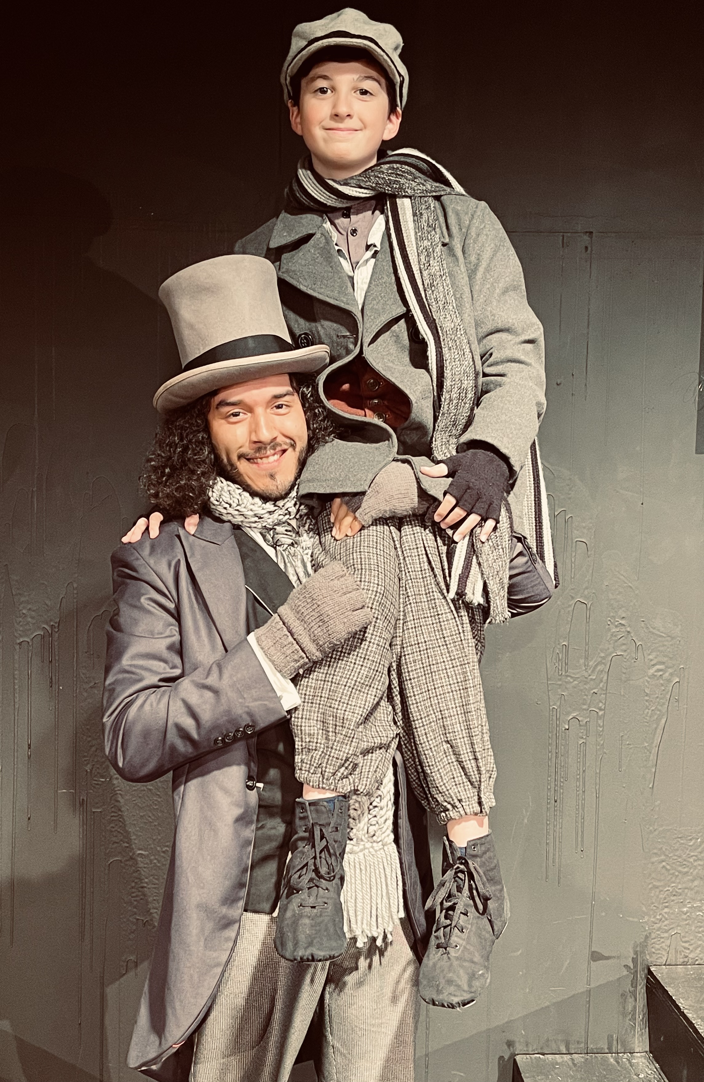 Bob Cratchit played by Giovanni Marine and Tiny Tim played by Giovanni Ladd