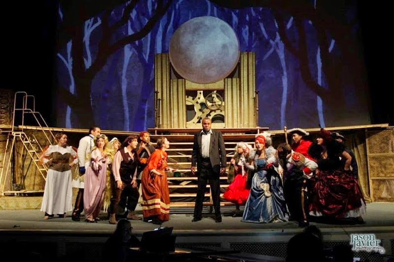 Ever After: At center stage, playing The Narrator and The Mysterious Man, Darryl Maximilian Robinson leads the 2014 cast of Into The Woods at The Hall of Liberty at Forest Lawn Cemetery in LA.