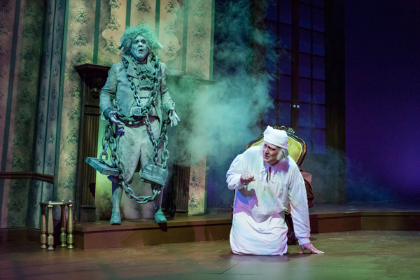Marley (George Thagard) appears to Scrooge (Jeff Wilson) in Theatre Tuscaloosa's production of Romulus Linney's adaptation of 