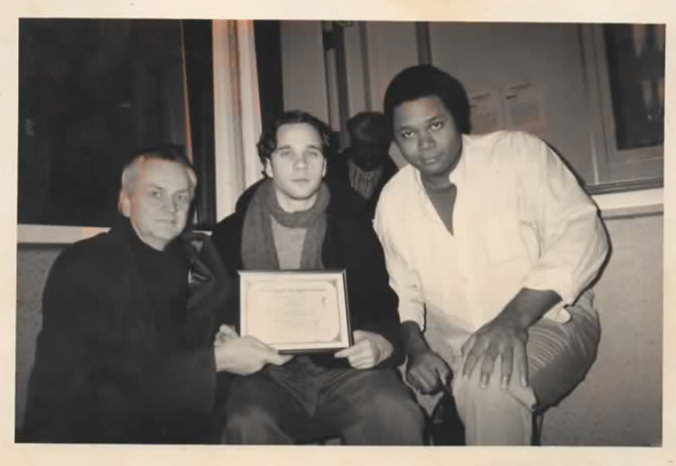 ESC Godot Actor Honored: ESC Producers Darryl Maximilian Robinson and Jeffrey Wayne Helgeson take photo with ESC Member Shawn Lee Martin, winner of a 1998 WKKC Radio Critics Corner Fine Arts Award.