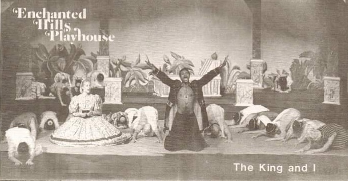 Praise To Buddha: With Elizabeth Lee Taylor as Mrs. Anna looking on, Darryl Maximilian Robinson as The King promises to build her a house in the 1984 Enchanted Hills Playhouse The King and I.