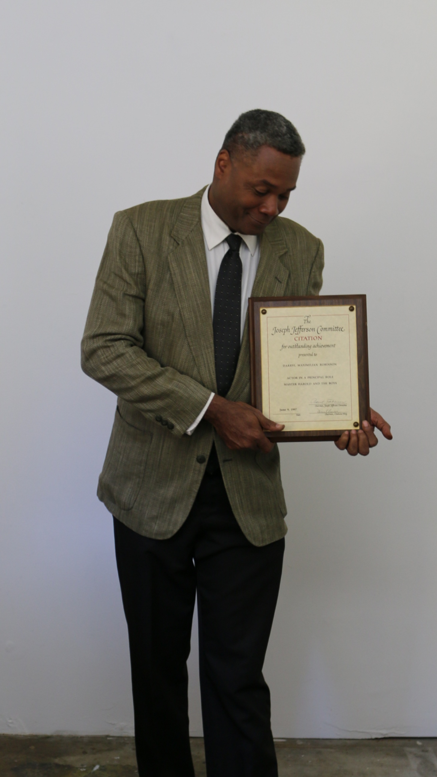His Favorite: 2017 Photo of Darryl Maximilian Robinson with his 1997 Chicago Joseph Jefferson Citation Award for Outstanding Actor In A Play for Master Harold and The Boys by Jesse L. Watt.