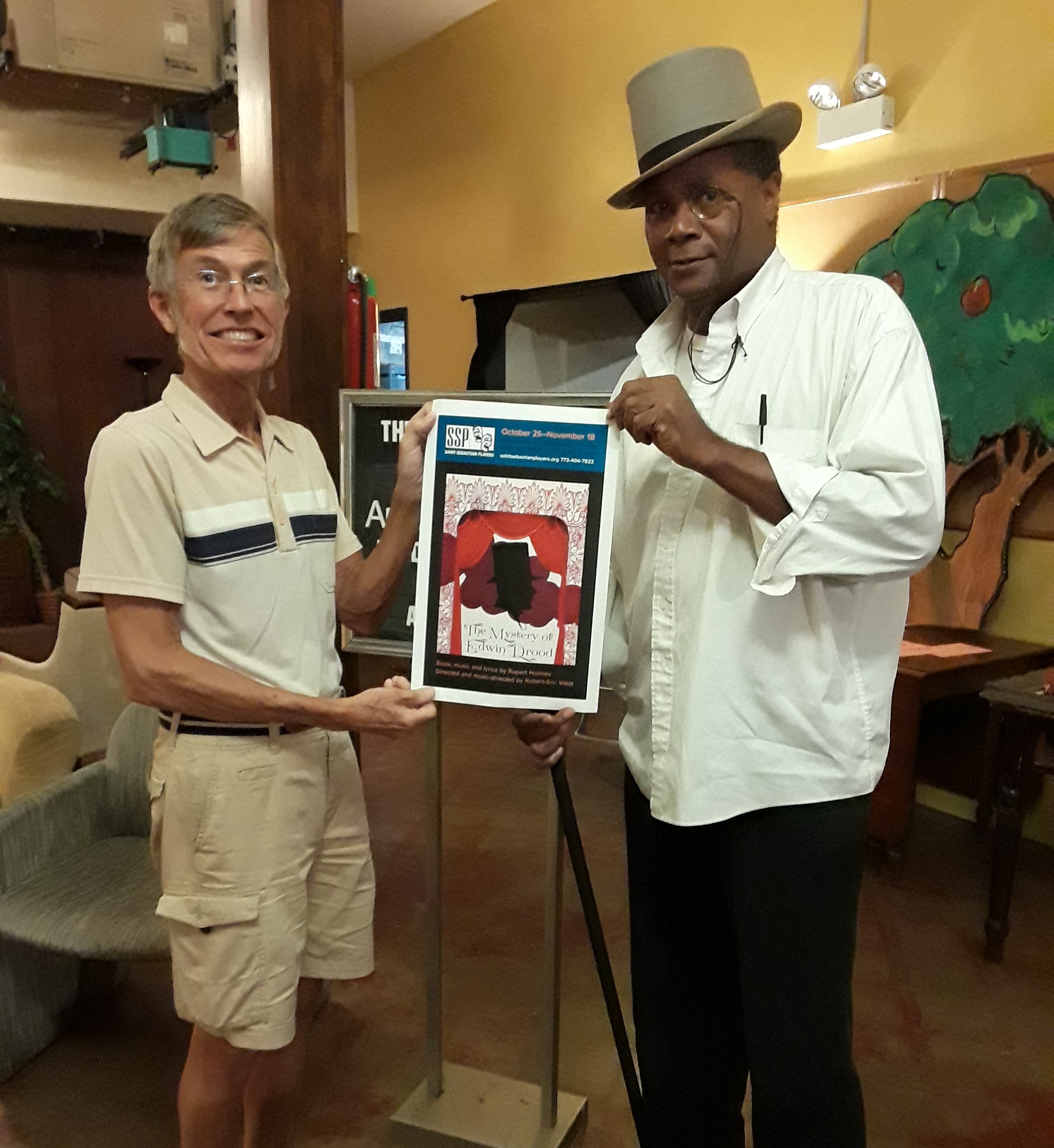 Crisparkle Rehearsal: Joined by Russ Gager as The Reverend Crisparkle, Darryl Maximilian Robinson as Chairman Mr. William Cartwright takes time to promote Drood at St. Bonaventure Church in Chicago.