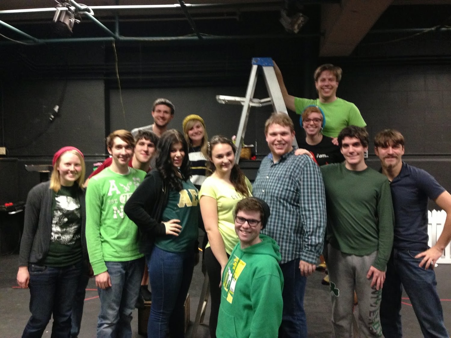 The whole cast and crew wearing green. 