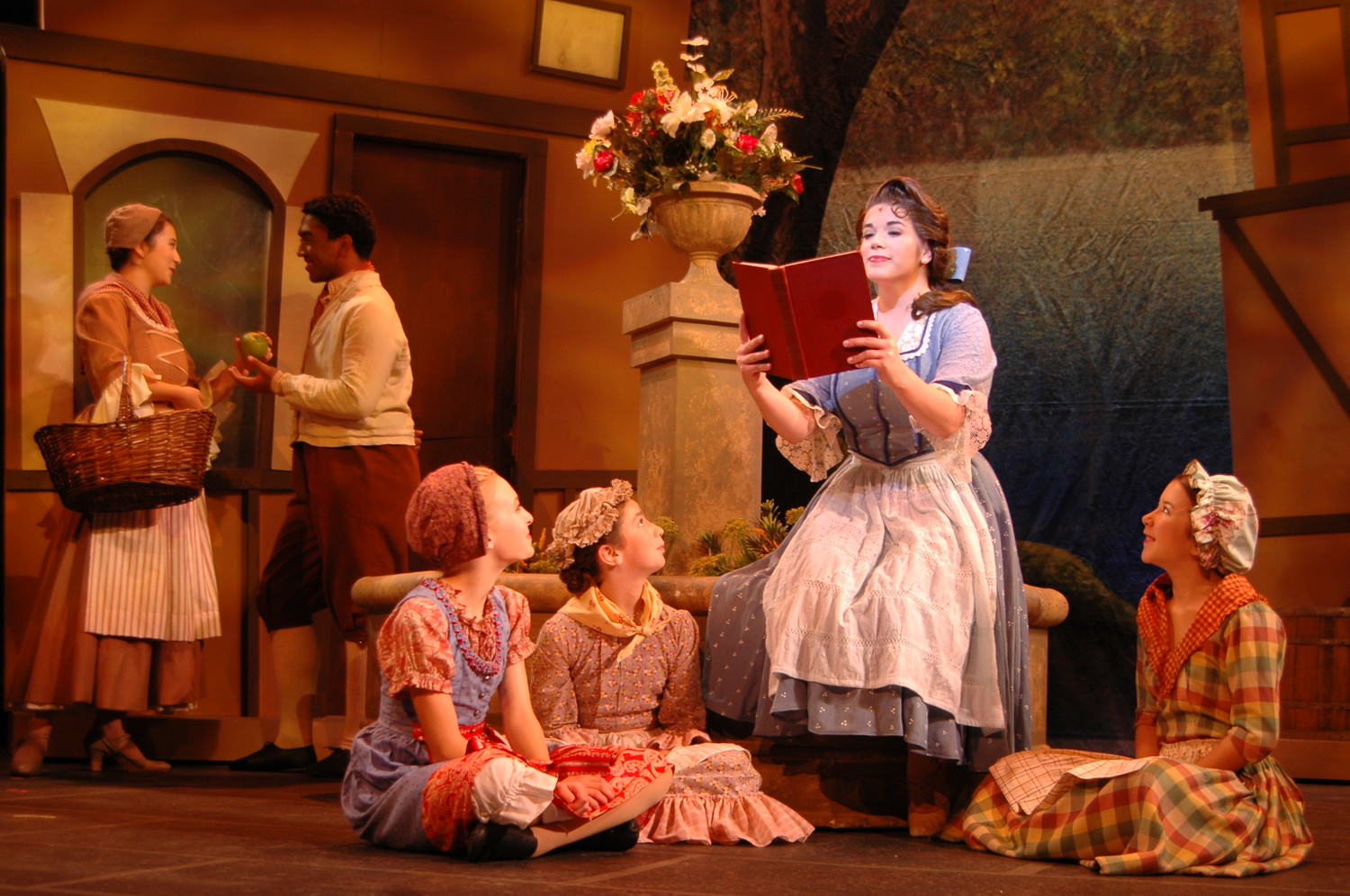 Belle reading a book in Act 1 performing 