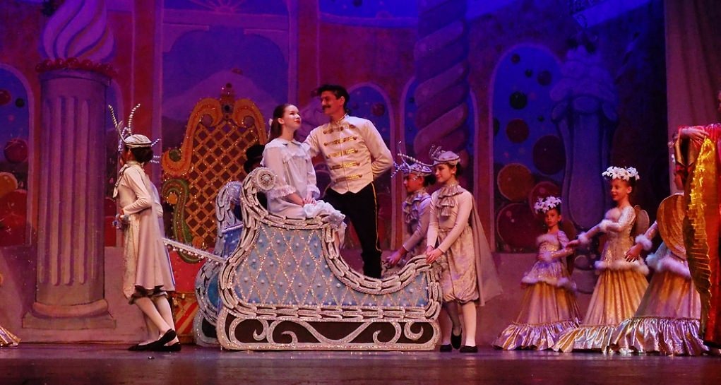 Clara and the Nutcracker leave the Land of Sweets. Clara and the Nutcracker leave the Land of Sweets.