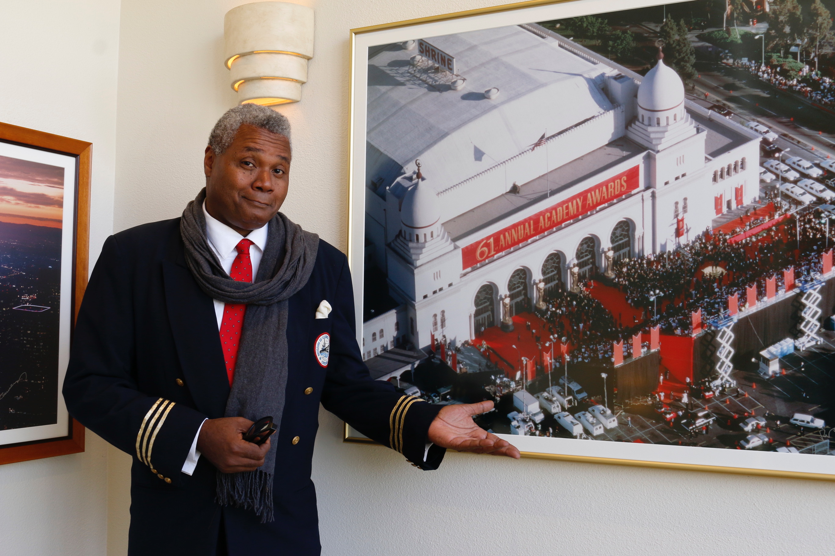 Darryl Maximilian Robinson admires the 61st annual Oscars Ceremony photograph at UBNGO studios in Burbank CA prior to making his fourth appearance as A Guest Actor on Ron Brewington's internet performing arts television show 'The Actor's Choice'. Photo by J.L. Watt.