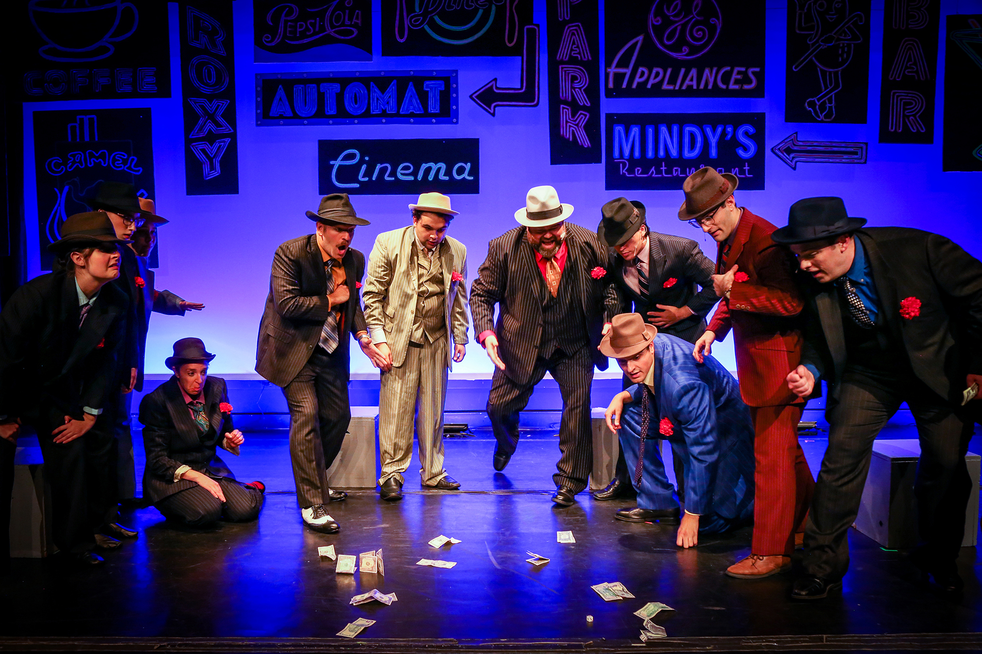 Ensemble with (middle left to right) Nathan Detroit (Joseph DeMaio), Liver Lips Louie (Aidan Falzon), Big Jule (Gary Glass), Harry the Horse (Jake McNerney), Angi the Ox (Eric Bras), Benny Southstreet