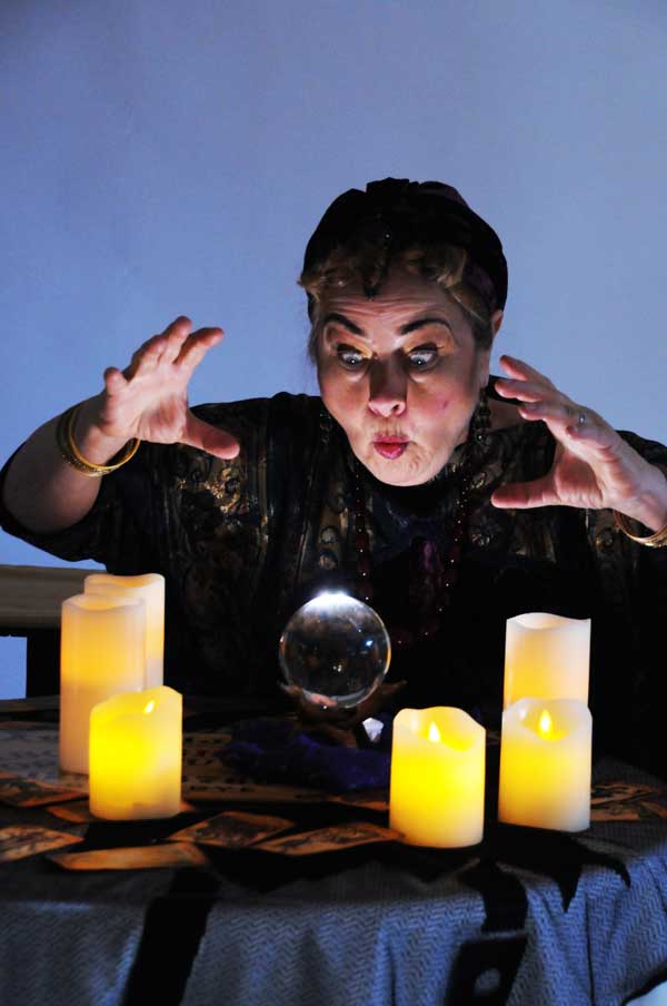 Madame Arcati (Caren Graham) summons the spirits in the classic Noël Coward comedy, BLITHE SPIRIT at Lakewood Theatre Company, September 9 - October 16, 2022 in Lake Oswego, Oregon. Photo by Triumph Photography