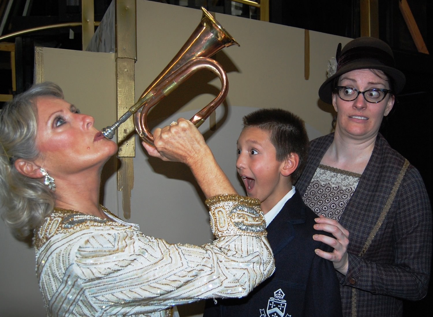 Mame Dennis (Patty Ward) blows her bugle to declare” It’s Today” as Young Patrick Dennis (Jonas Annear) and Agnes Gooch (Kathleen Duffy) look on.