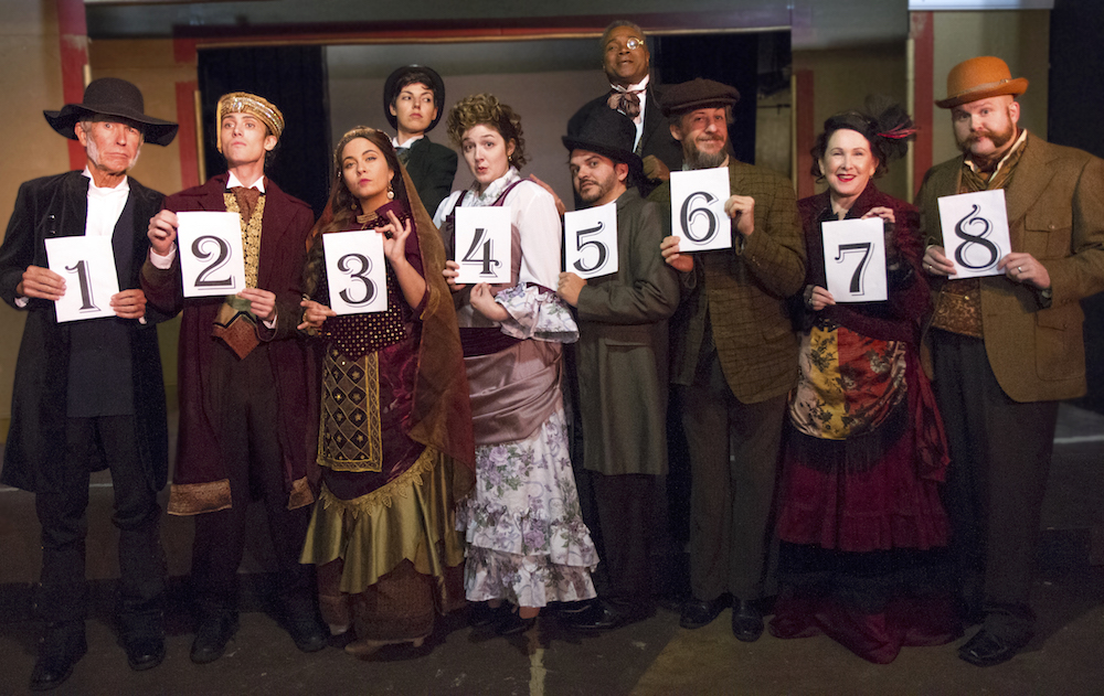 The 8 Prime: Joined by talented Sarah Myers as Edwin Drood, Darryl Maximilian Robinson as The Chairman Mr. William Cartwright presents the suspects in the 2018 St. Sebastian Players of Chicago revival
