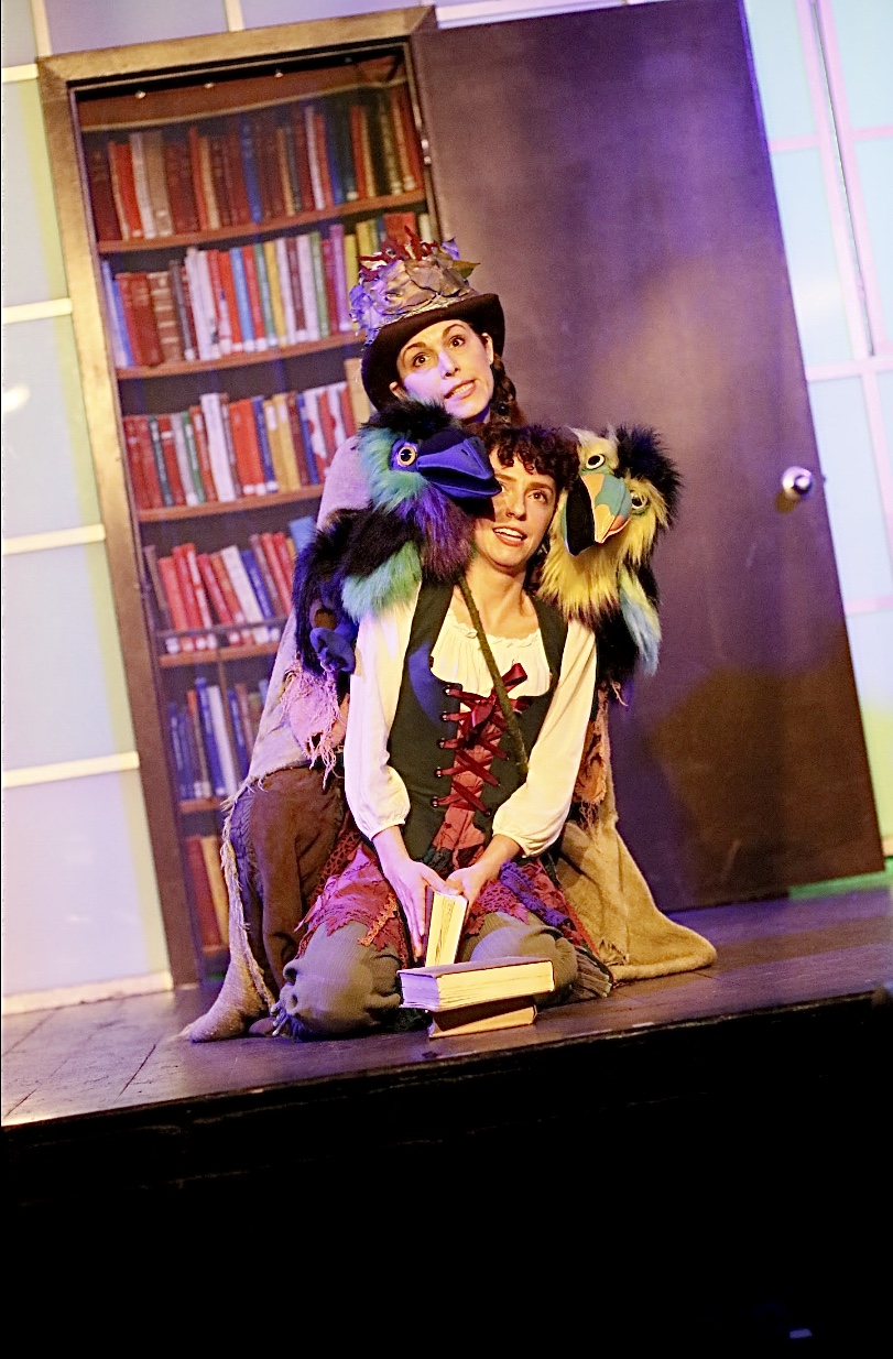 The Scatterbirds (Carrie-ann Pishnak, top) and our hero Amari (Jessie Sherman, bottom) try to find a word they rhymes with orange while in the Great Library in the forest. The Scatterbirds (Carrie-ann Pishnak, top) and our hero Amari (Jessie Sherman, bottom) try to find a word they rhymes with orange while in the Great Library in the forest.