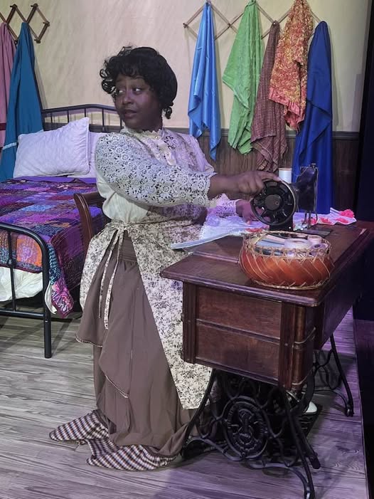 Esther (Nakeisha McGee) is stitching away on INTIMATE APPAREL for a client in the opener for Season 42 at Carpenter Square. Esther (Nakeisha McGee) is stitching away on INTIMATE APPAREL for a client in the opener for Season 42 at Carpenter Square.