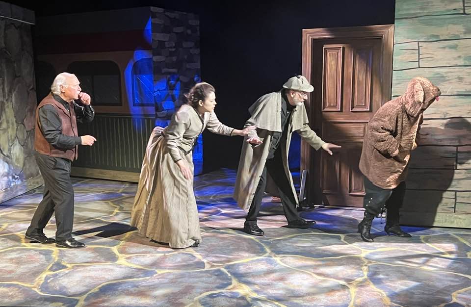 The hound leads the way!Pictured L-R: John Covaleski, Allyson Rose, Tim Jolly and Loryn Mac as Dr. Watson, Irene Adler, Sherlock Holmes and the hound.