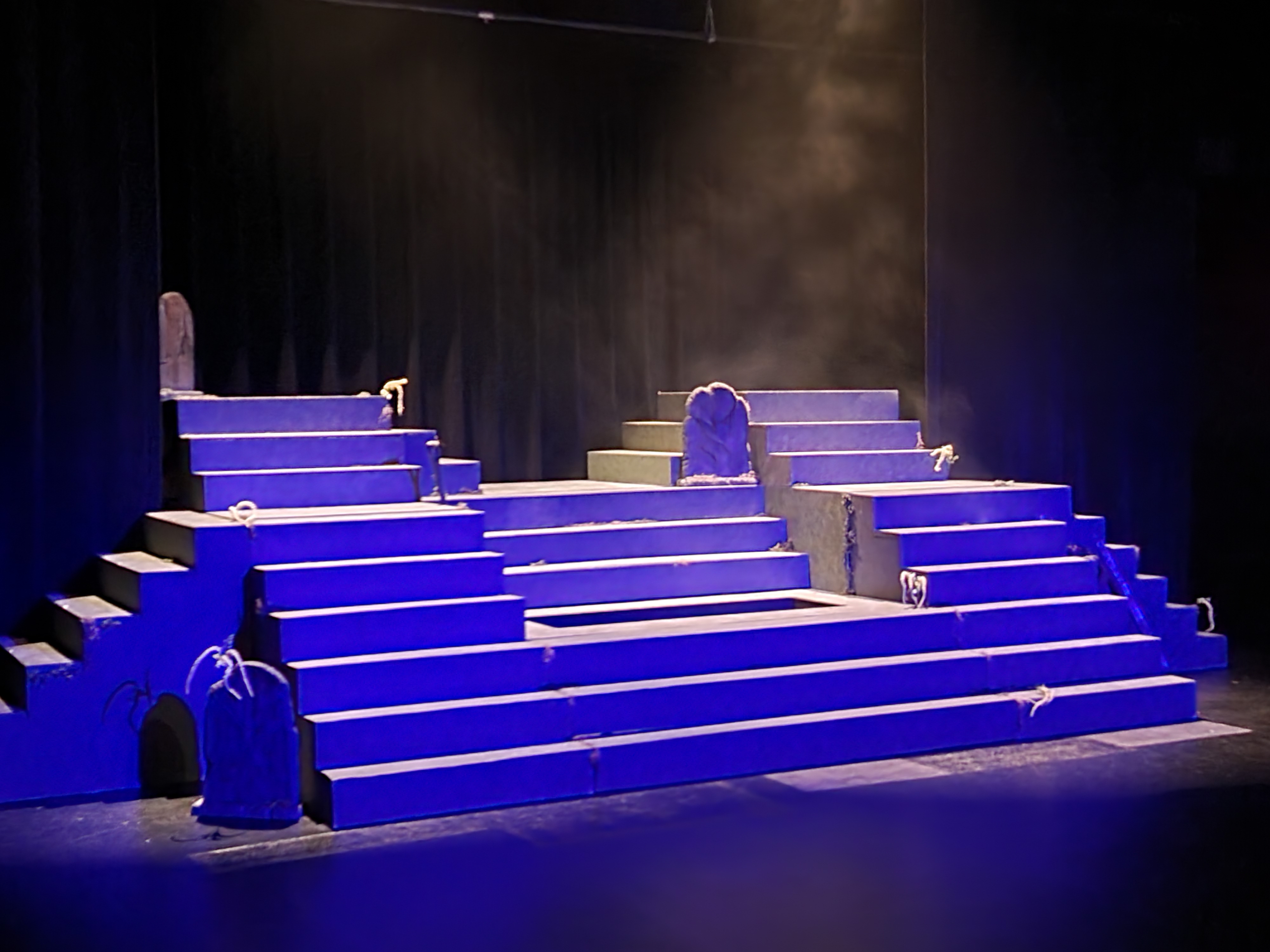 The set combining the Midwestern set cemetery of Spoon River with a Greek style of storytelling.