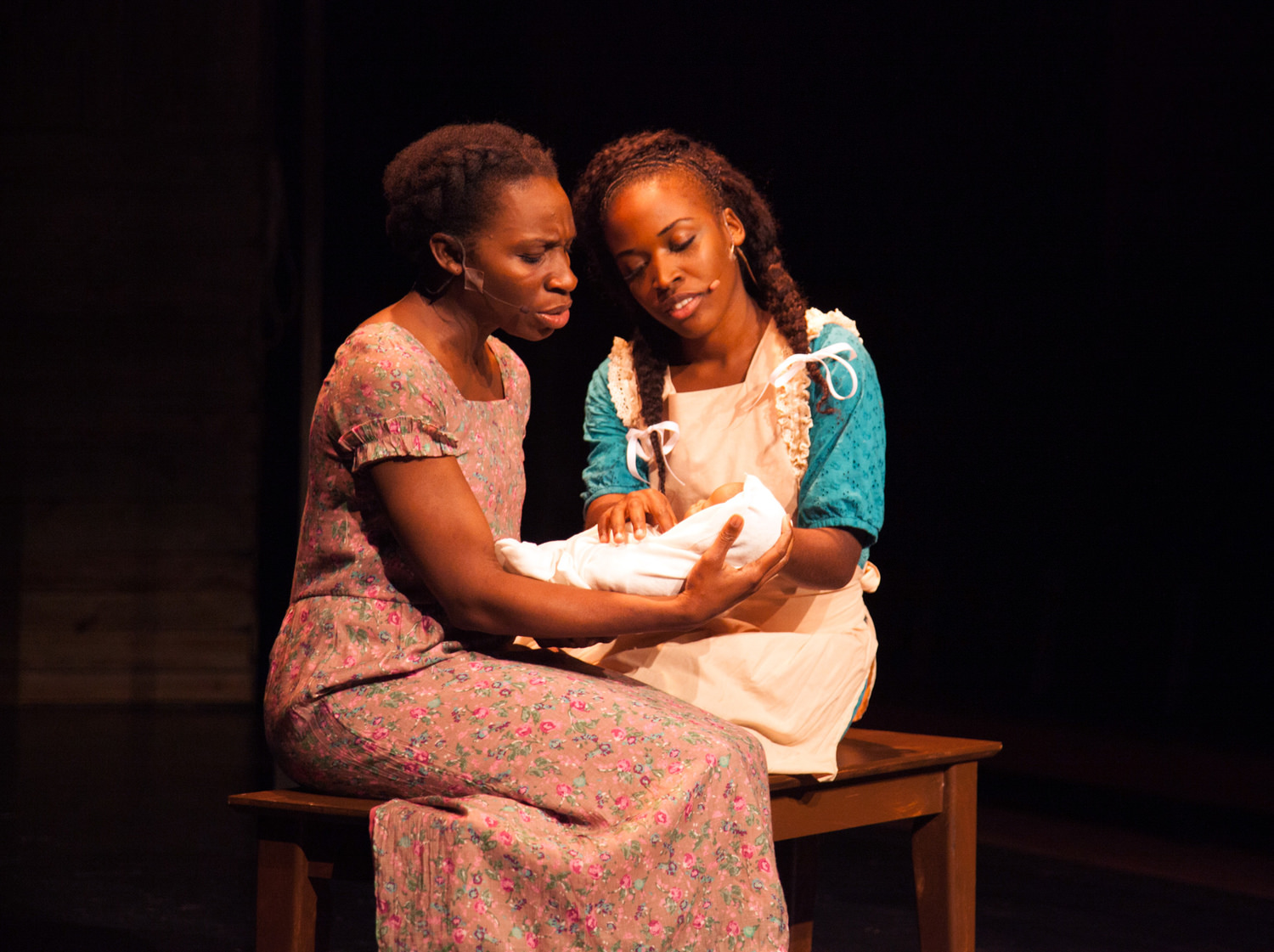 Apphia Campbell (Celie) and Khadijah Rolle (Nettie) admire Ceile's baby | Photo by Don Daly Photo