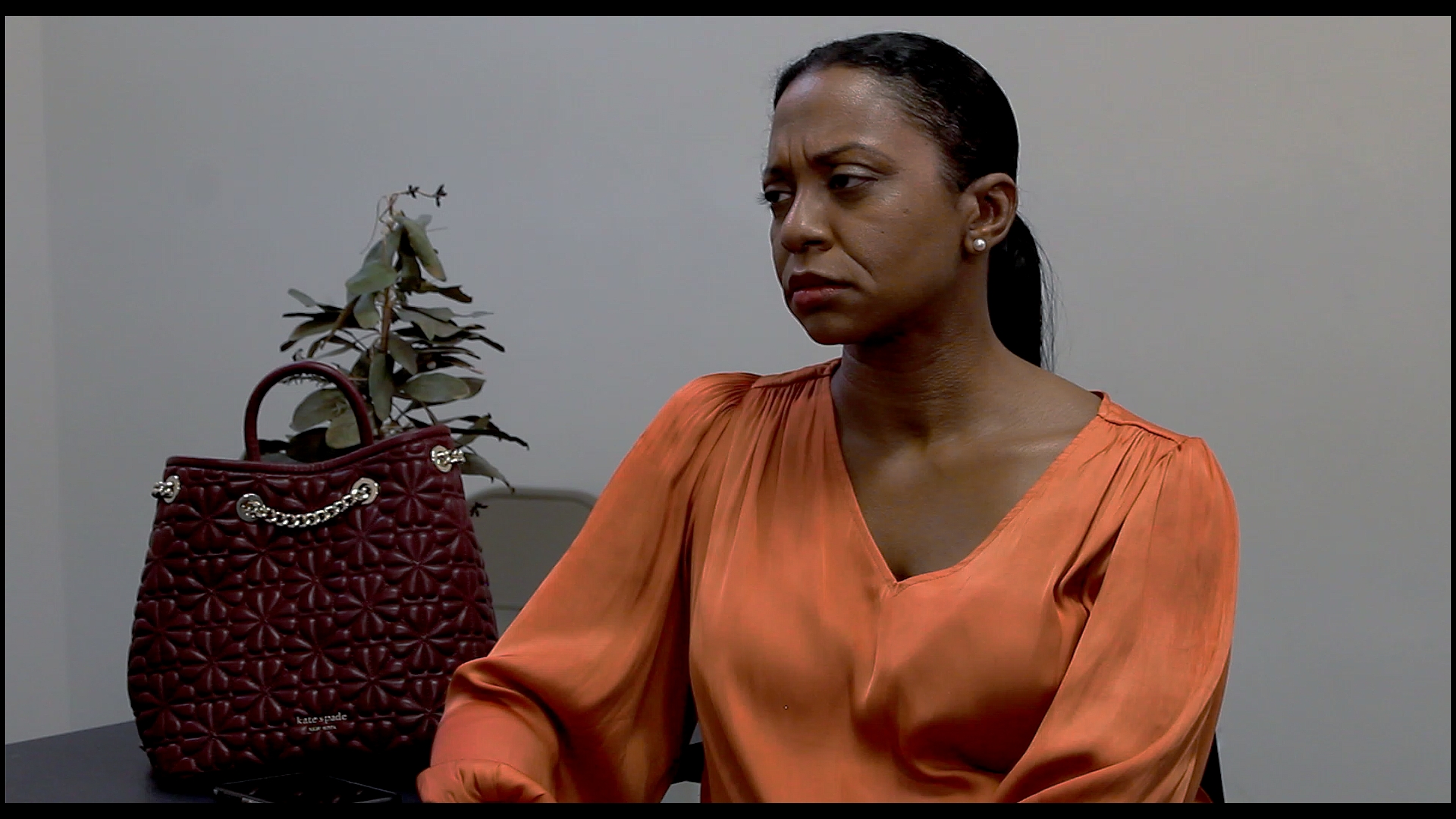 The Interviewer (Darlene Elizabeth Joiner) learns something about her past.