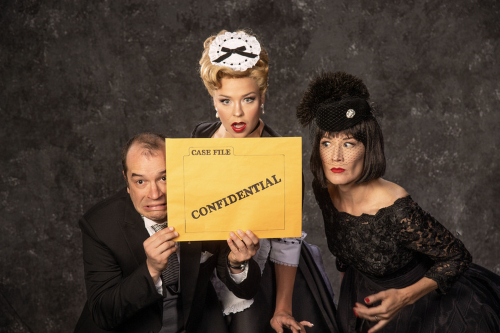 Aaron Galligan-Stierle (left) as Wadsworth, Bailey Blaise as Yvette, and Melinda Parrett as Mrs. White in the Utah Shakespeare Festival’s 2022 production of Clue. (Photo by Karl Hugh. Copyright Utah Shakespeare Festival 2022.)