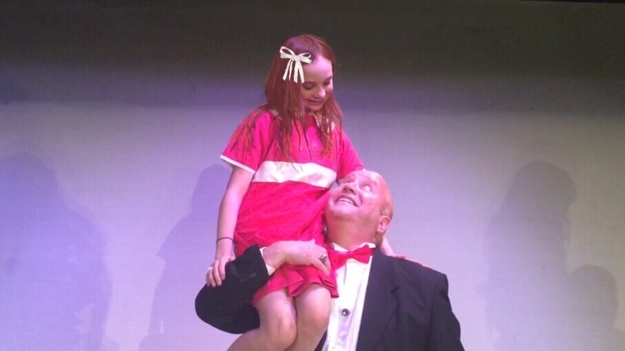 Karma Good and Ric Bertolotti as Annie and Oliver “Daddy” Warbucks.