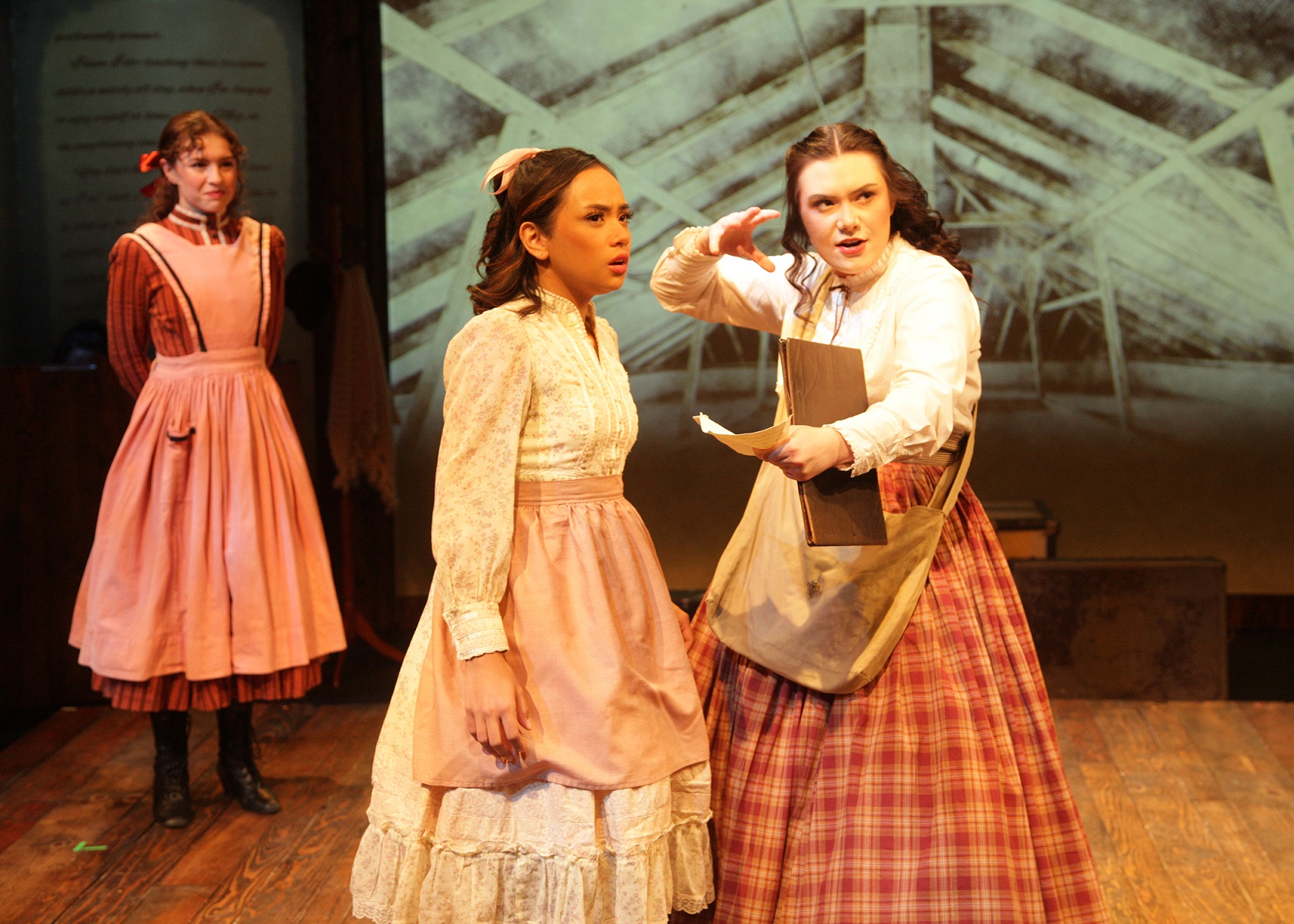 Emily Abeles as Beth March, Camie Del Rosario as Amy March, and Sarah Pierce as Jo March Chance Theater's production of 